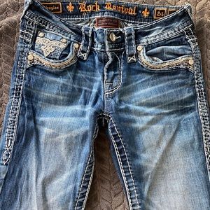 Rock revival light wash blue jeans.